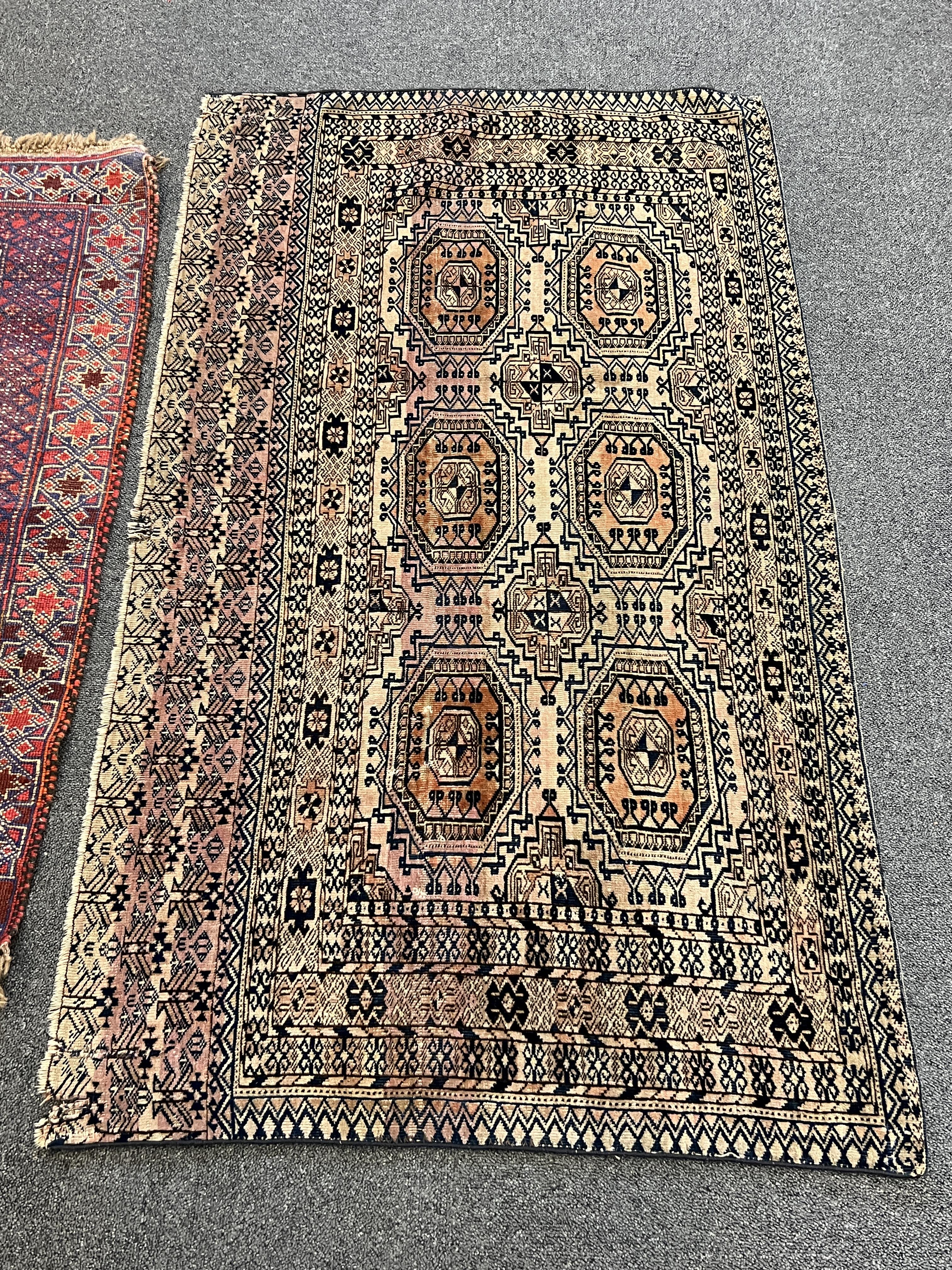 Two Afghan rugs / saddlebags, larger 104 x 108cm. Condition - fair
